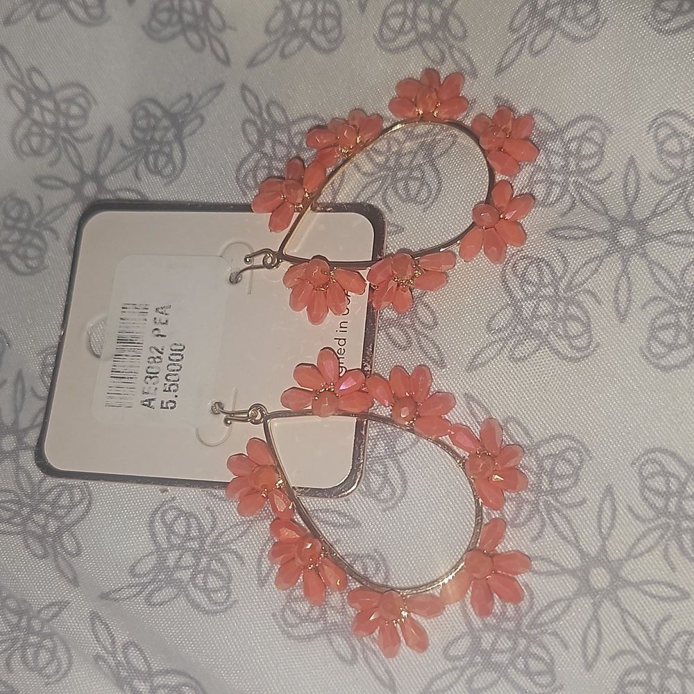 Gold pea shaped earrings with orange designs
